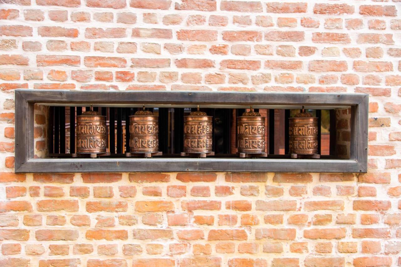 Basera Boutique Hotel 카트만두 외부 사진 Prayer wheels at the temple